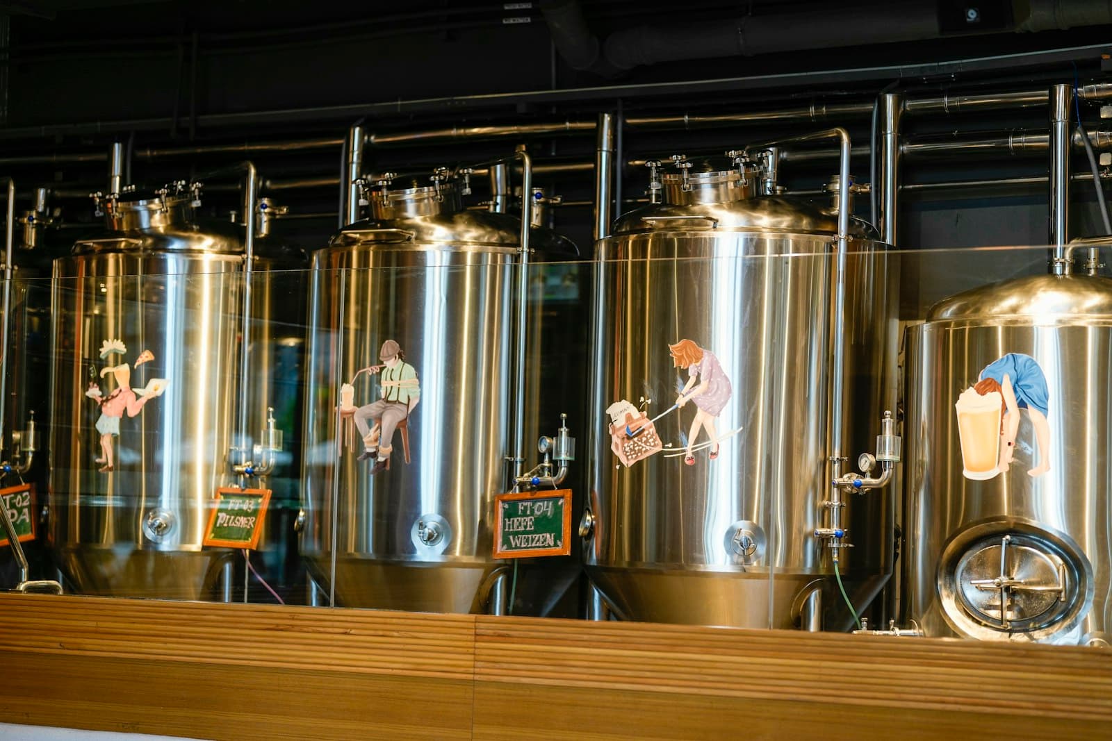 Stainless steel brewery fermentation tanks in a row