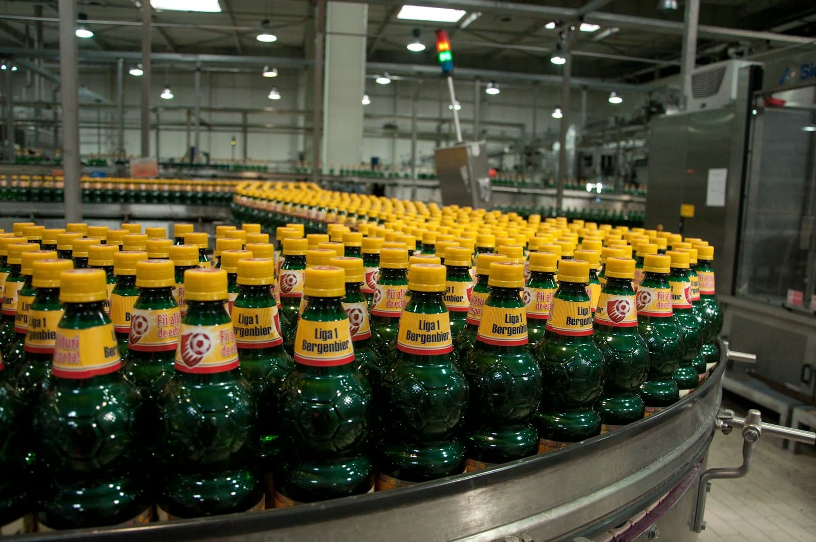 Capped bottles on a rotary filling machine, the line runs a bottling module records