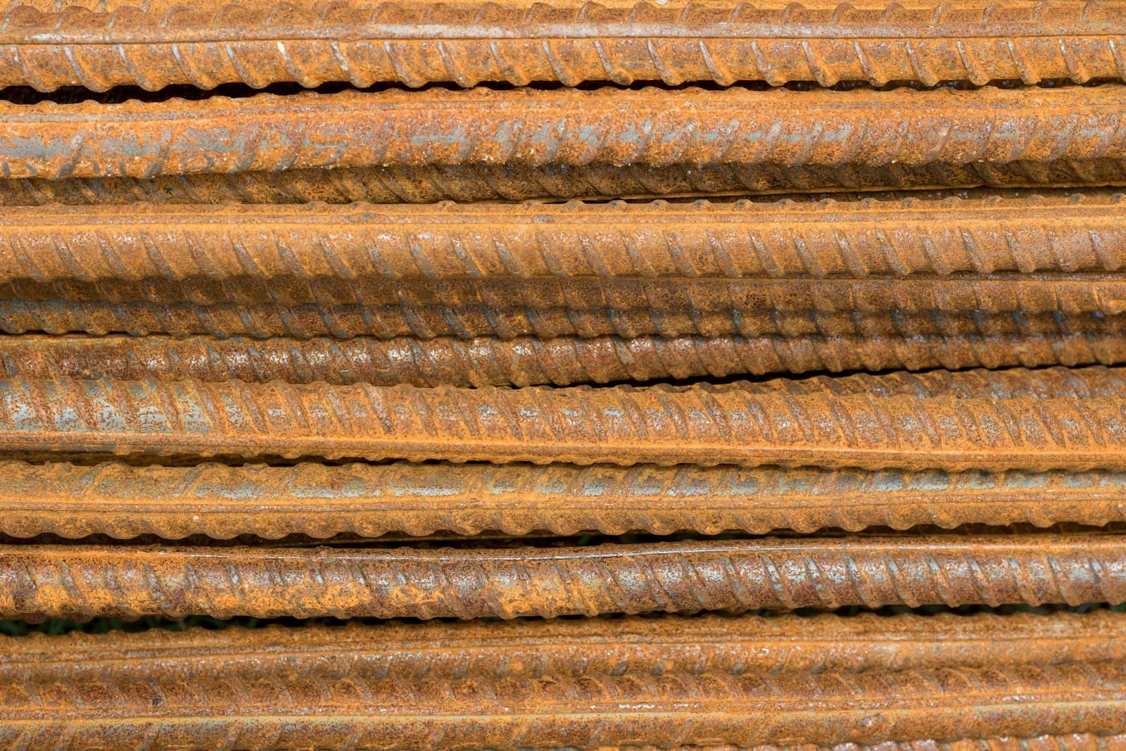 Stacked steel reinforcement bars, a construction material tracked by stock and issue