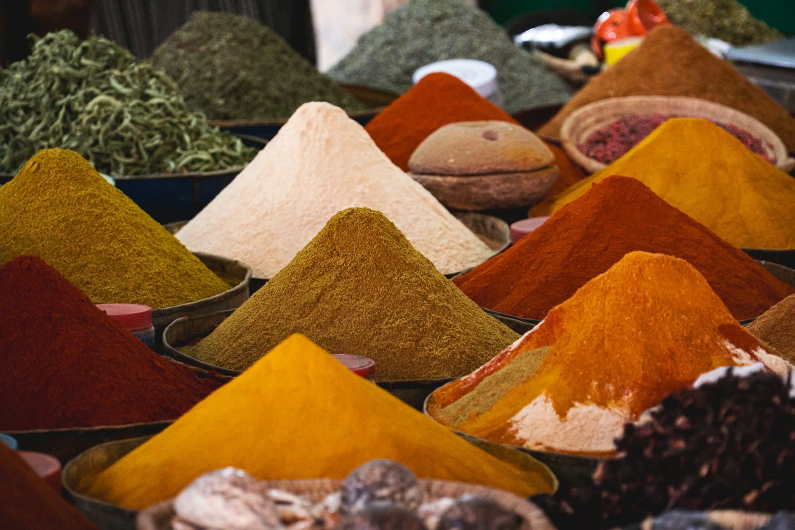 Heaps of coloured spices and powders